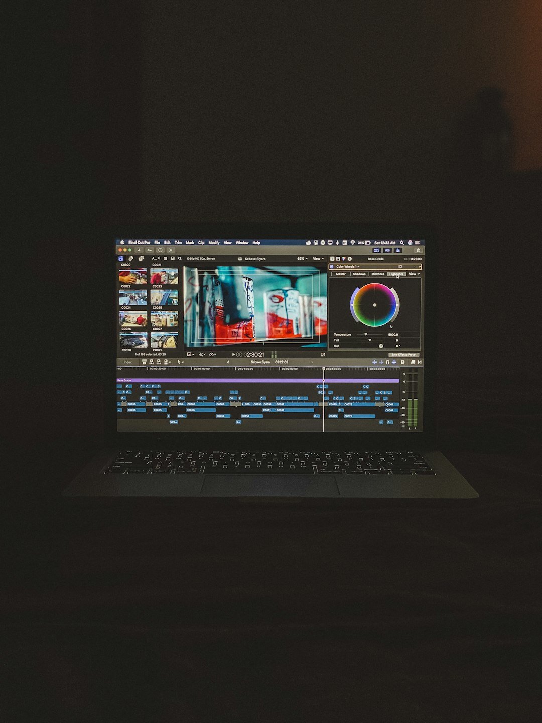 filmmaker editing on laptop