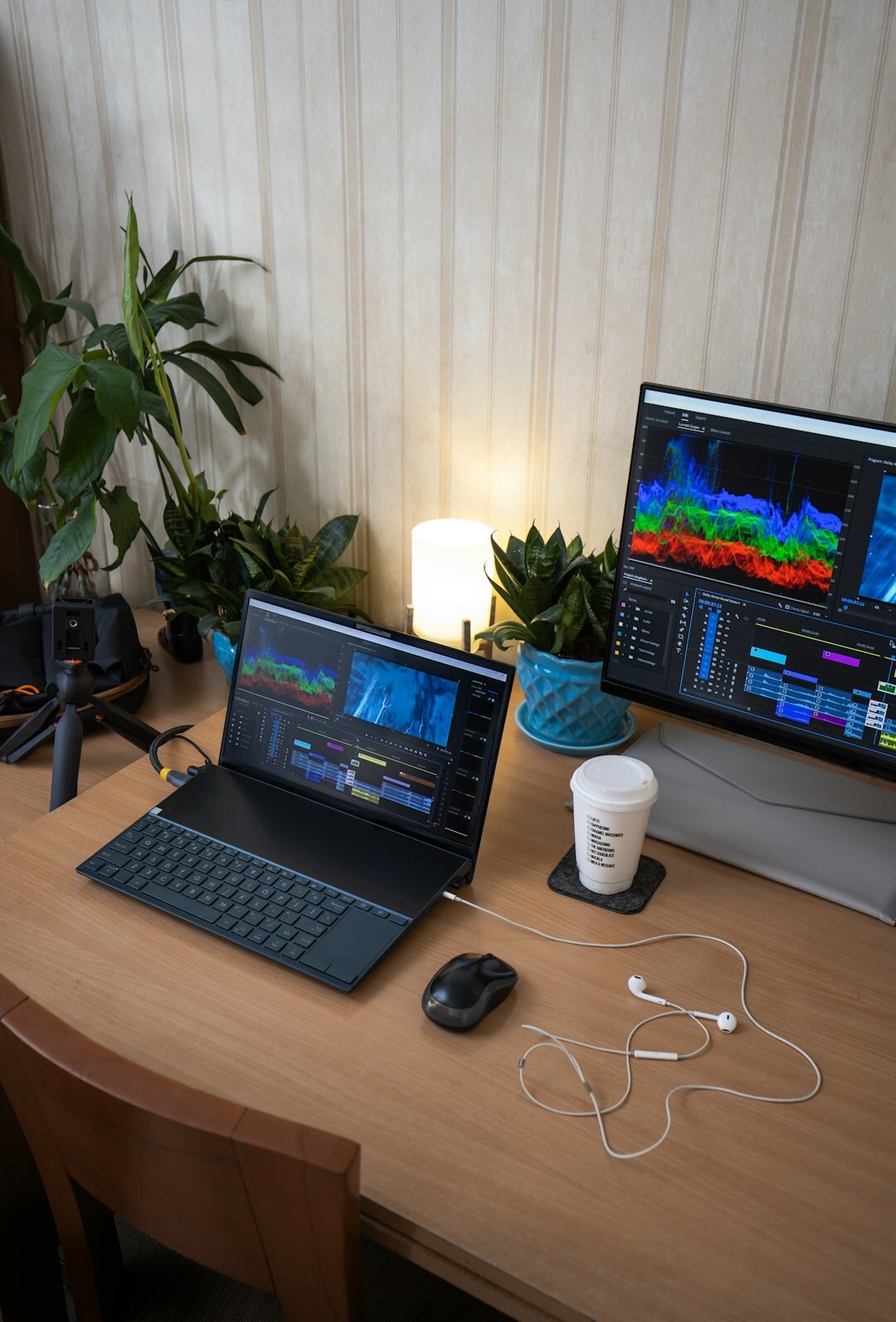 Video editor working at a multi-monitor editing suite